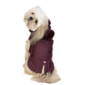 Lhasa Apso facing forward wearing one of the luxury waterproof dog raincoats in burgundy by HollyOwl.